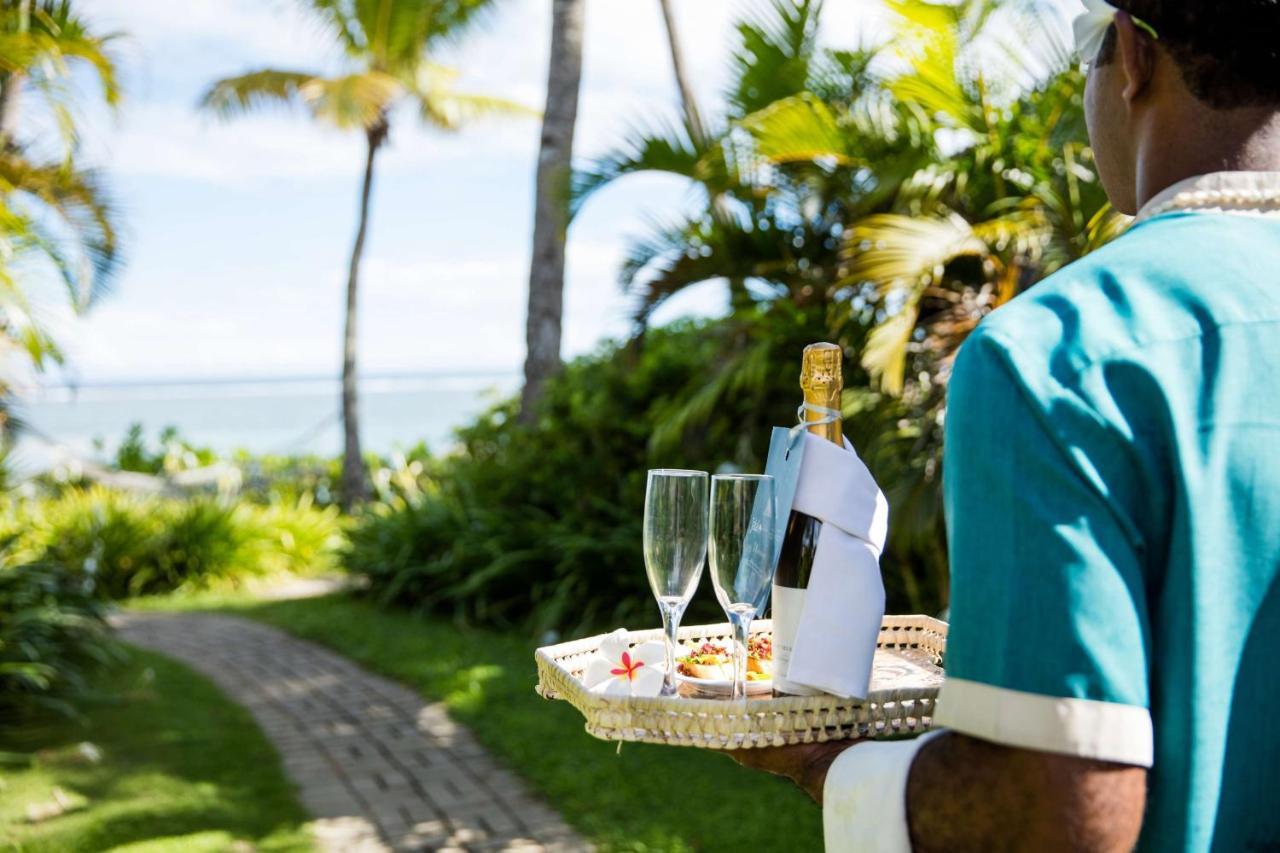 Outrigger Fiji Beach Resort Korotogo Exteriér fotografie A butler at the Four Seasons Resort Maldives at Landaa Giraavili